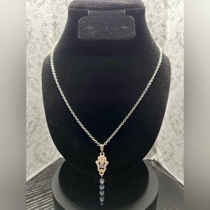 18.5” Necklace with hand evil eye pendant and chain extender. Made by Mua.